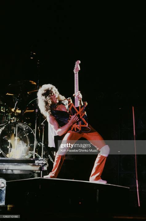 Eddie Van Halen of Van Halen performs on stage playing the guitar on ...