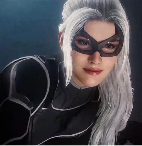 A Woman With White Hair Wearing A Catwoman Mask And Black Catsuits On