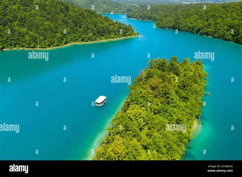 Aerial View Of The Kozjak Lake With The White Boat Plitvice Lakes