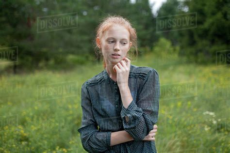 Portrait Of Caucasian Girl Standing In Field Stock Photo Dissolve