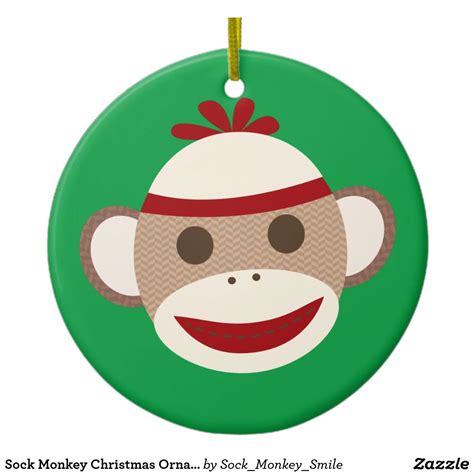 A Monkey Ornament With A Red Bow On It S Head Is Shown