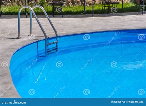 Swimming Pool on the Background of Blue Water . Stock Image - Image of ...