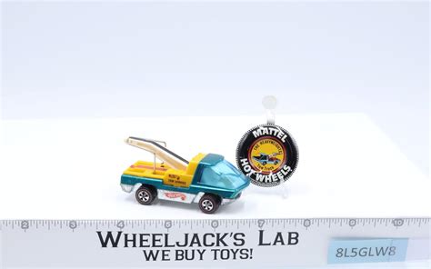 The Heavyweights Tow Truck Aqua Teal Hot Wheels Mattel Redline Rl W Button Wheeljack S Lab