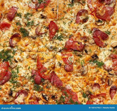 Baked Round Pizza With Smoked Sausages Mushrooms Tomatoes Cheese And