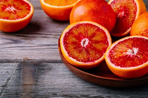 Premium Photo Sliced And Whole Ripe Juicy Sicilian Blood Oranges On