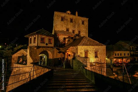 Famous rebuilt historic bridge in downtown Mostar at night Stock Photo ...