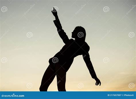 Silhouette Of A Dancing Woman Pointing In Night Sky Woman Silhouette