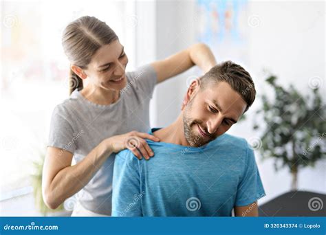 Modern Rehabilitation Physiotherapy Woman Worker With Man Client Neck