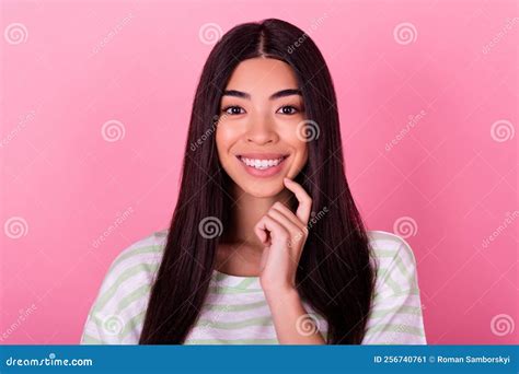 Portrait Of Cute Cheerful Indonesian Lady Hand Finger Touch Chin Beaming Smile Isolated On Pink