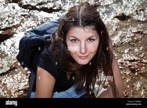 Portrait Of Woman Crouching At Beach Hi Res Stock Photography And