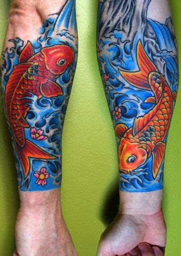 A Man S Legs With Tattoos On Them And Two Goldfishs In The Water