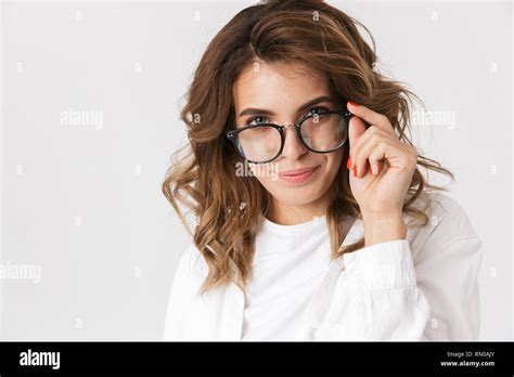 Portrait Of Gorgeous Woman Wearing Eyeglasses Smiling While Standing Isolated Over White