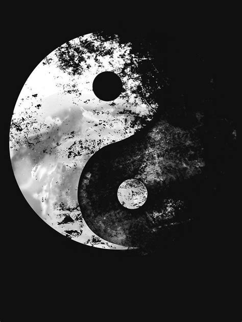 A Black And White Photo Of A Yin Yang Symbol On A Dark Background