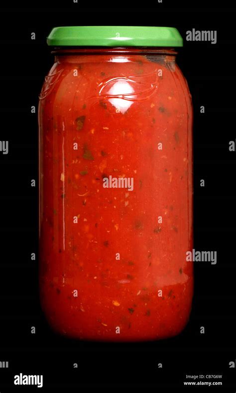 Pasta sauce in a jar on black background Stock Photo - Alamy