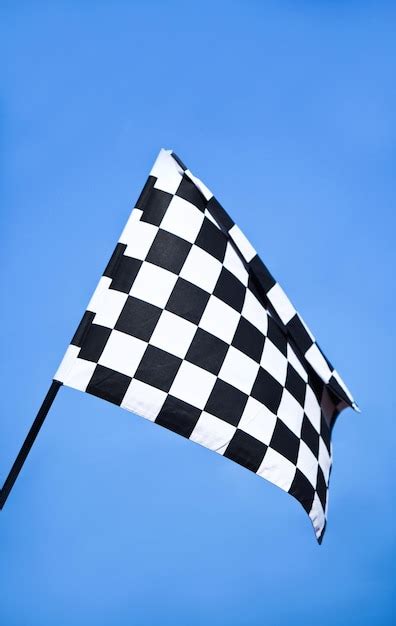 Premium Photo Checkered Racing Flag On The Finish Line