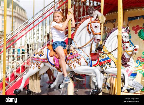 Girl Riding On A Merry Go Round Little Girl Playing On Carousel