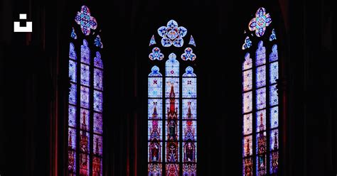 A Couple Of Large Stained Glass Windows In A Building Photo Free Art Image On Unsplash