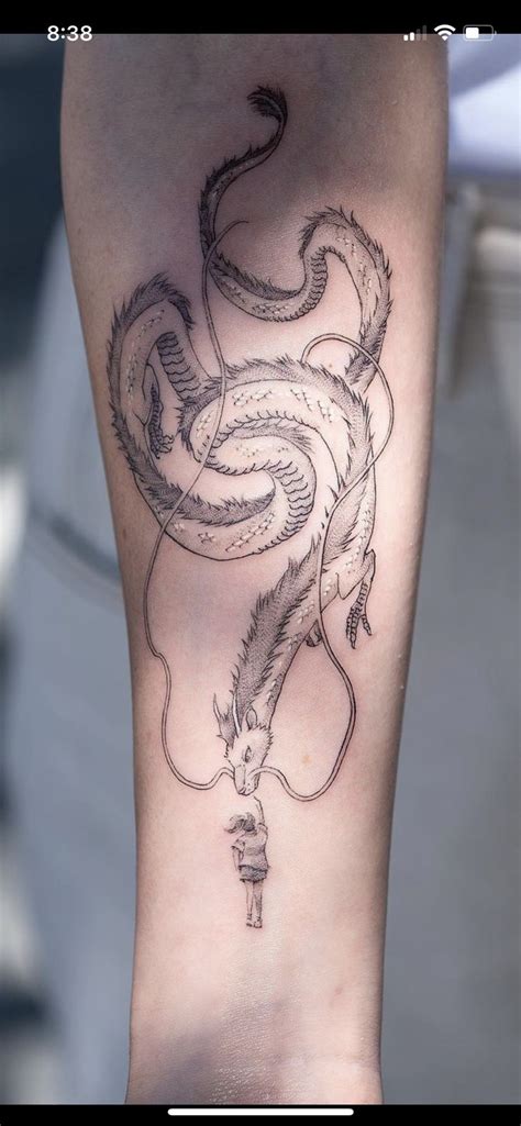 A Person With A Tattoo On Their Arm That Has A Snake In The Middle Of It