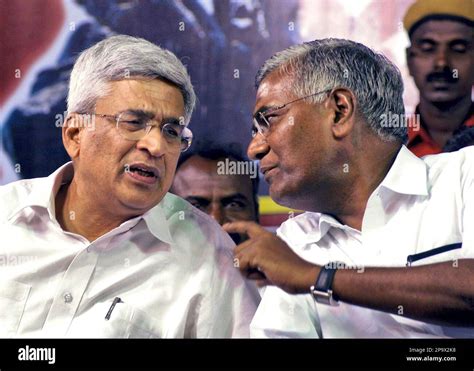 Communist Party of India (Marxist) leader Prakash Karat, left, speaks ...