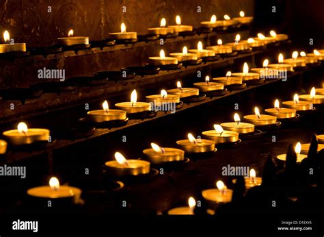 Burning candles in a church Stock Photo - Alamy