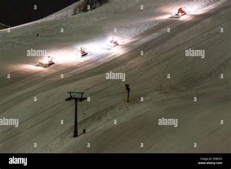 Snow groomer equipment at night Stock Photo - Alamy