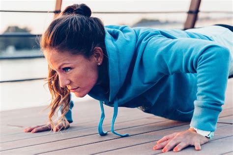 Premium Photo | Woman doing push ups