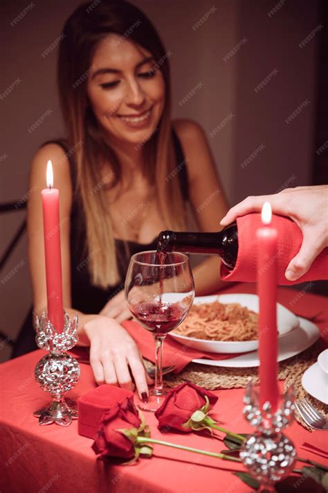 Free Photo Man Pouring Wine In Glass Of Woman