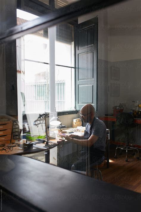 Relaxed Scene Of An Artisan Working At His Atelier By Stocksy Contributor Miquel Llonch