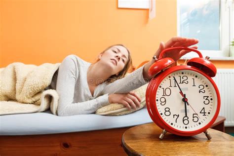 Woman Waking Up Turning Off Alarm Clock In Morning Stock Image Image