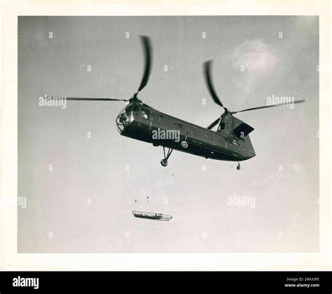 Photograph of Tandem Rotor Helicopter in Flight Stock Photo - Alamy