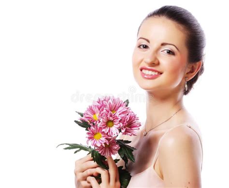 Young Beautiful Woman With Bouquet Of Pink Flowers Isolated On Stock