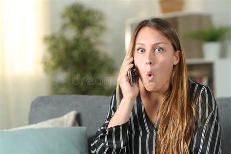 Surprised Woman Talking On Phone Looks At Camera Stock Image Image Of