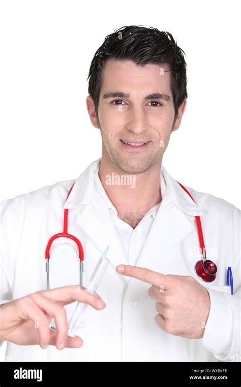 Doctor Holding A Needle Stock Photo Alamy