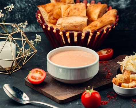 Free Photo Tomato Soup With Crackers In White Bowles