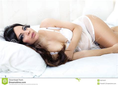 Beautiful Woman In White Lingerie Lying On A Bed Stock Image Image Of