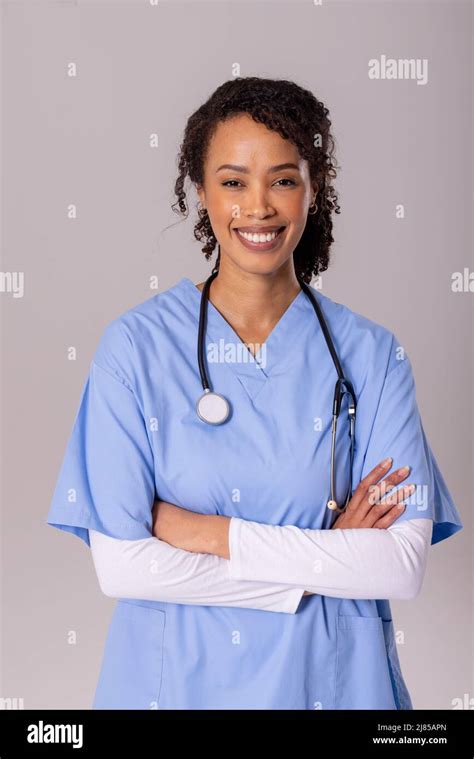 Portrait Of Smiling African American Mid Adult Female Doctor With Arms