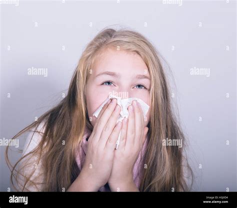 Sick Young Girl Blowing Her Nose With Paper Tissue Stock Photo Alamy