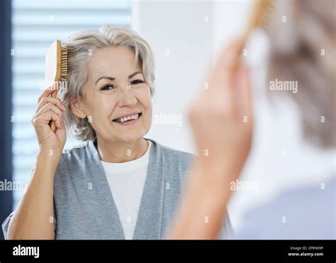 Mature Woman Hair Brushing Hi Res Stock Photography And Images Alamy