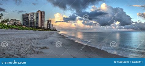 High Rise Buildings In The Distance On North Naples Beach At Sunrise