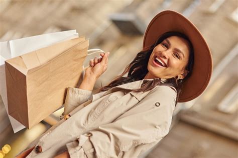 Positive Emotions Portrait Of A Young Excited Woman Wearing Grey Coat