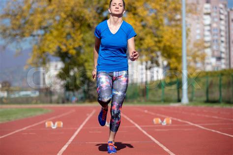 Female Sprinter Getting Ready to Start The Race | Stock image | Colourbox