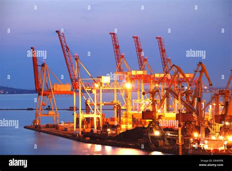 Port Warehouse With Cargoes And Containers At Night Stock Photo Alamy