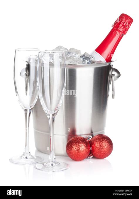 Champagne Bottle In Ice Bucket Two Empty Glasses And Christmas Decor