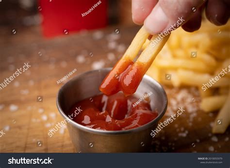 Dipping French Fries Into Ketchup Stock Photo 2010055979 Shutterstock