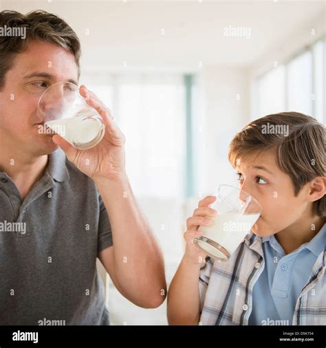 Father And Son Drinking Milk Stock Photo Alamy