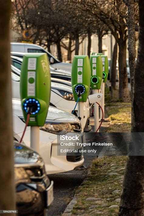 Electric And Hybrid Cars Charging At Public Charging Stations Stock