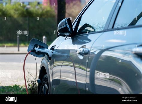 Charging Cable On An Electric Car Stock Photo - Alamy