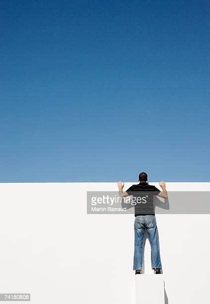 116 Man Peering Over Wall Stock Photos High Res Pictures And Images