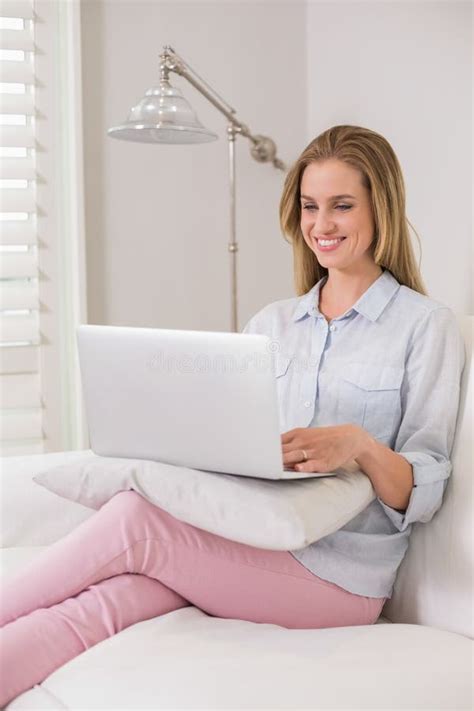 Laughing Casual Blonde Sitting On Couch Using Laptop Stock Photo Image Of Front Indoors 35019610