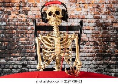 Human Skeleton Sitting Chair Listening Music Stock Photo 2194738421